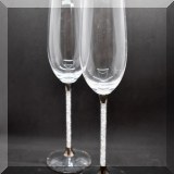 G16. Pair of Swarovski toasting flutes. 
